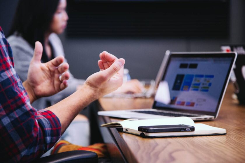 speaking with their hands at a meeting