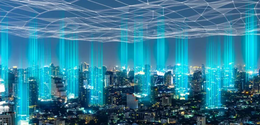 A city skyline illuminated by a network of blue lines representing digital connectivity.