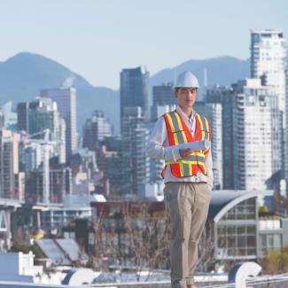 Urban planner standing by the city